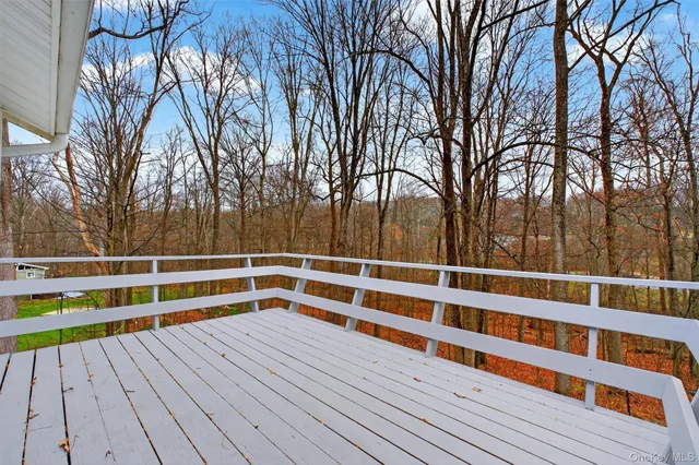 a view of wooden deck with a trees