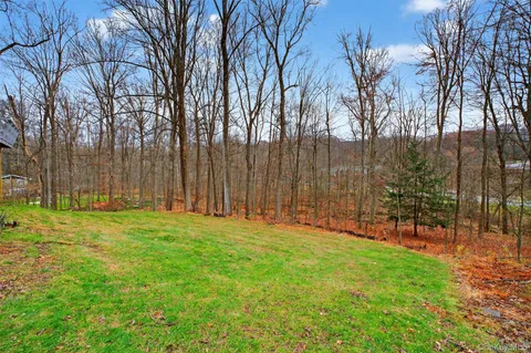 a view of outdoor space with deck and trees