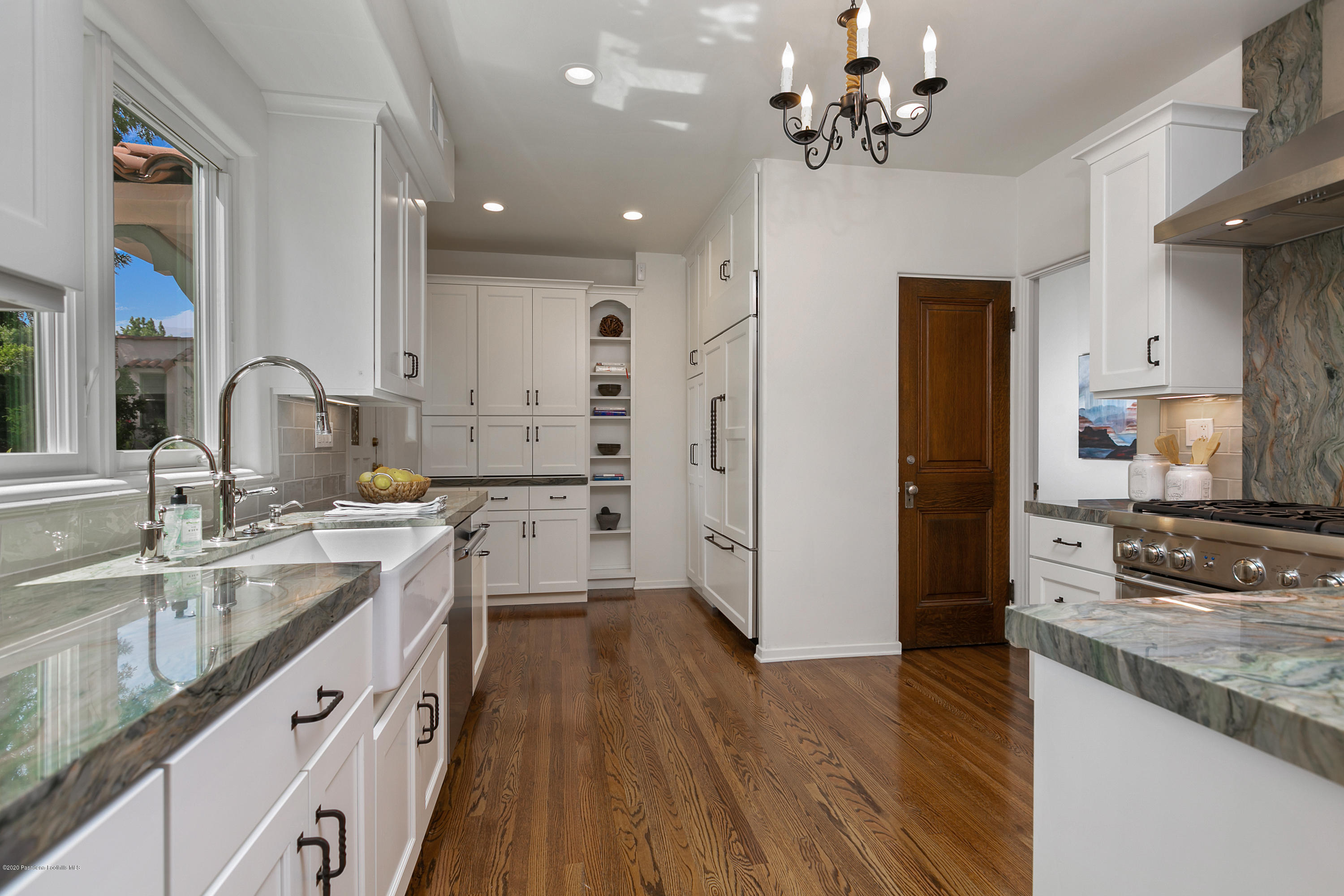 1691 Meadowbrook Road Altadena, CA 91001 - Photo 12 of 35 a kitchen with stainless steel appliances a sink stove and refrigerator