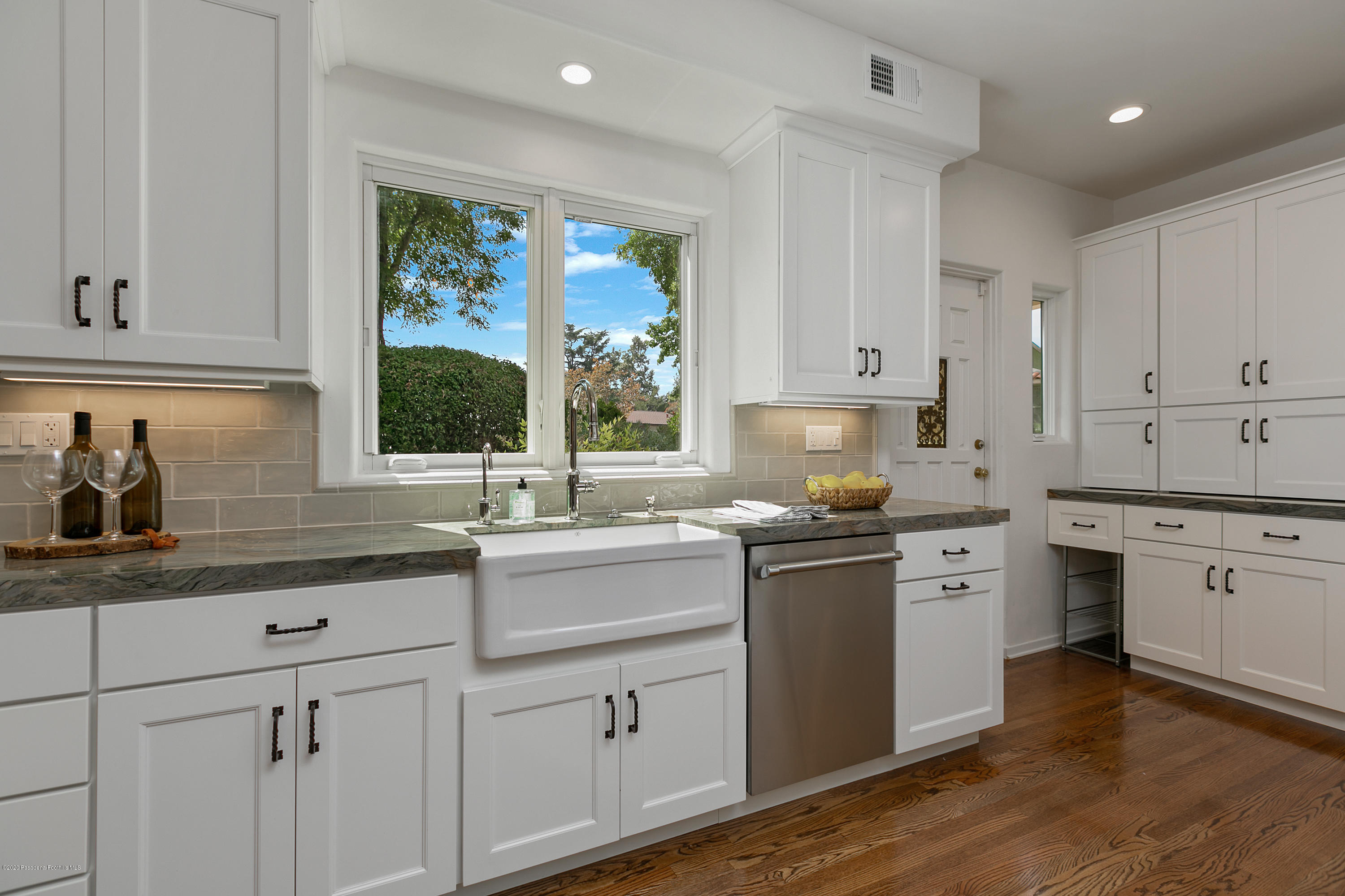 1691 Meadowbrook Road Altadena, CA 91001 - Photo 13 of 35 a kitchen with a sink stove and cabinets