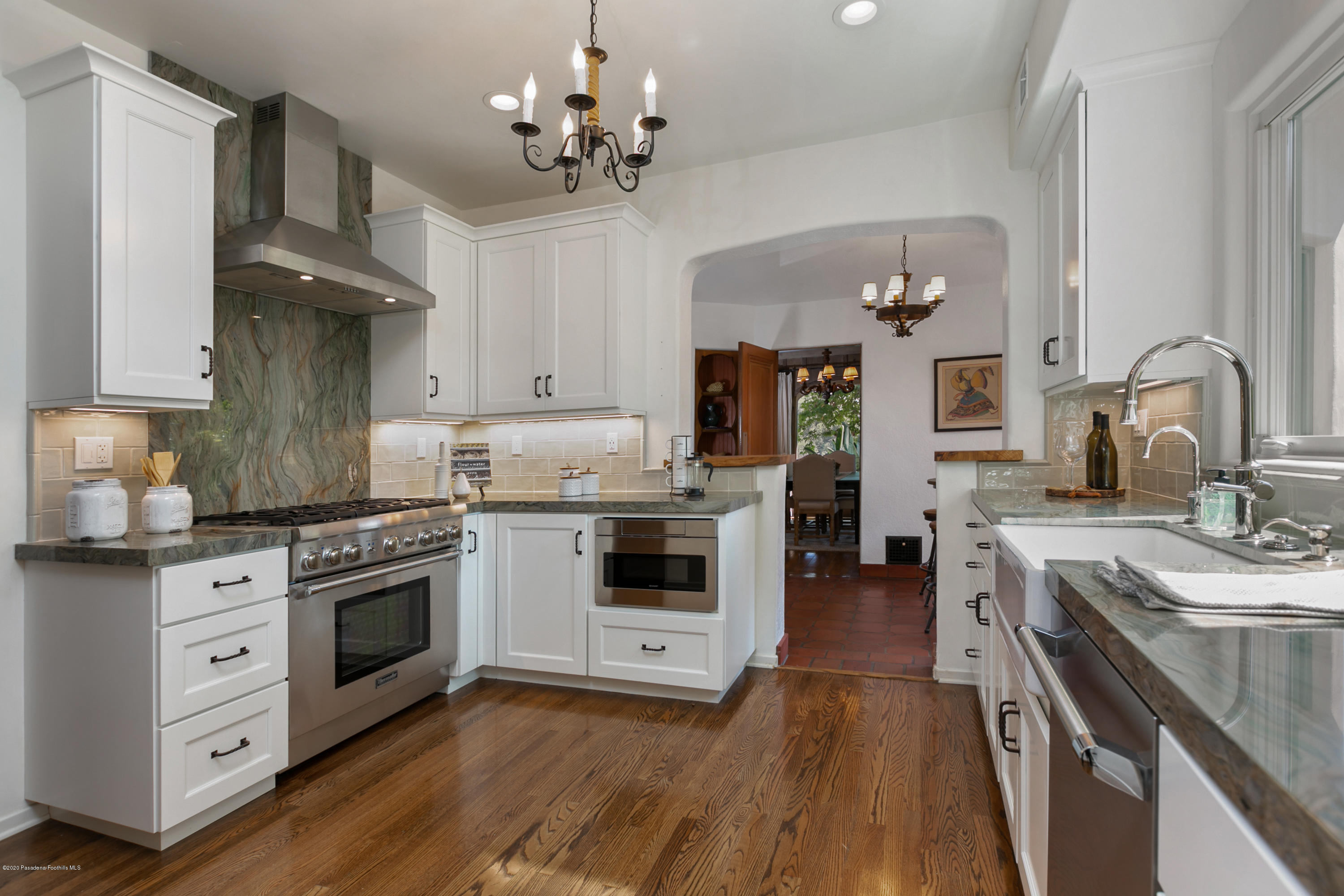 1691 Meadowbrook Road Altadena, CA 91001 - Photo 14 of 35 a kitchen with stainless steel appliances a stove sink and cabinets
