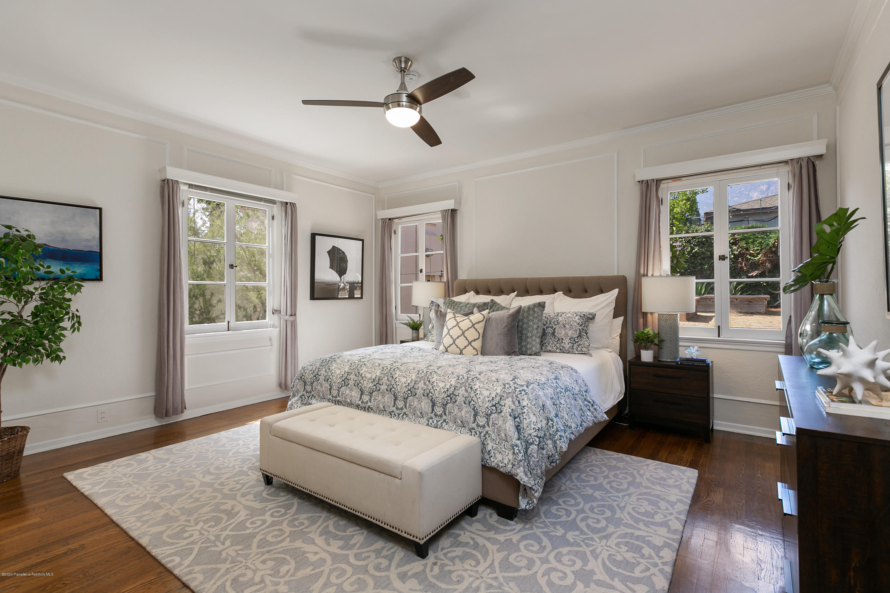 1691 Meadowbrook Road Altadena, CA 91001 - Photo 16 of 35 a spacious bedroom with a bed and glass window