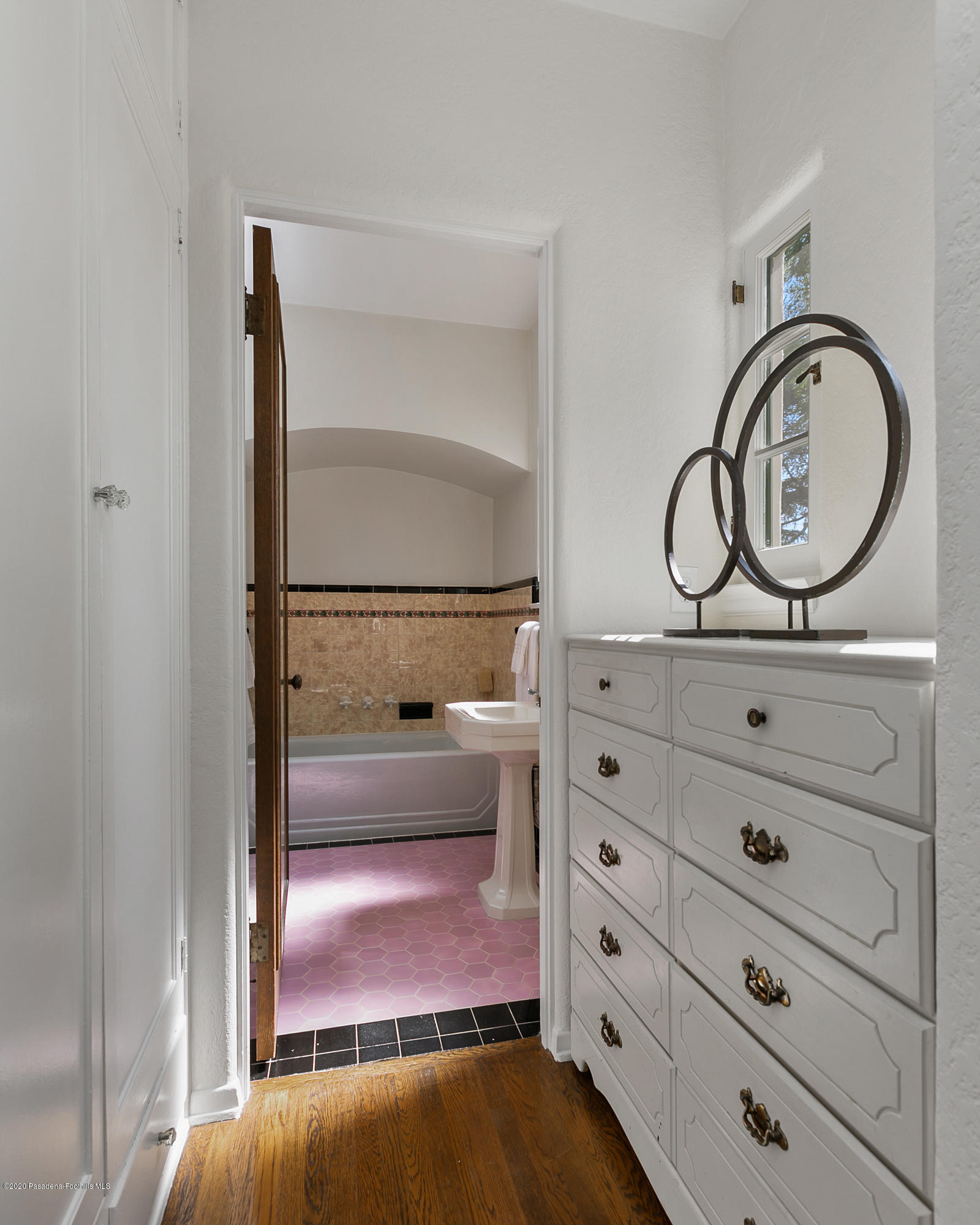 1691 Meadowbrook Road Altadena, CA 91001 - Photo 17 of 35 a bathroom with a mirror and a sink