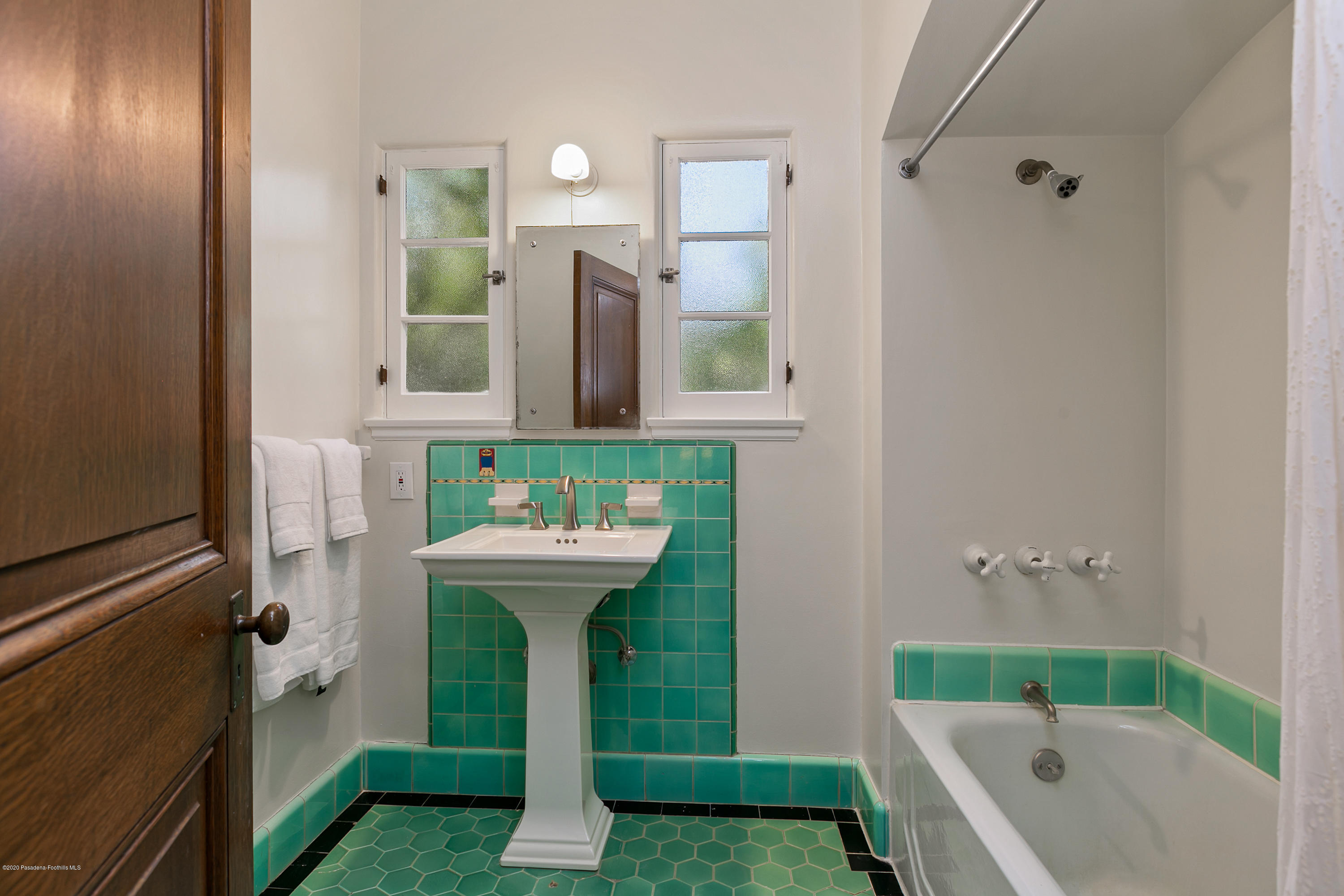 1691 Meadowbrook Road Altadena, CA 91001 - Photo 22 of 35 a bathroom with a sink and a mirror