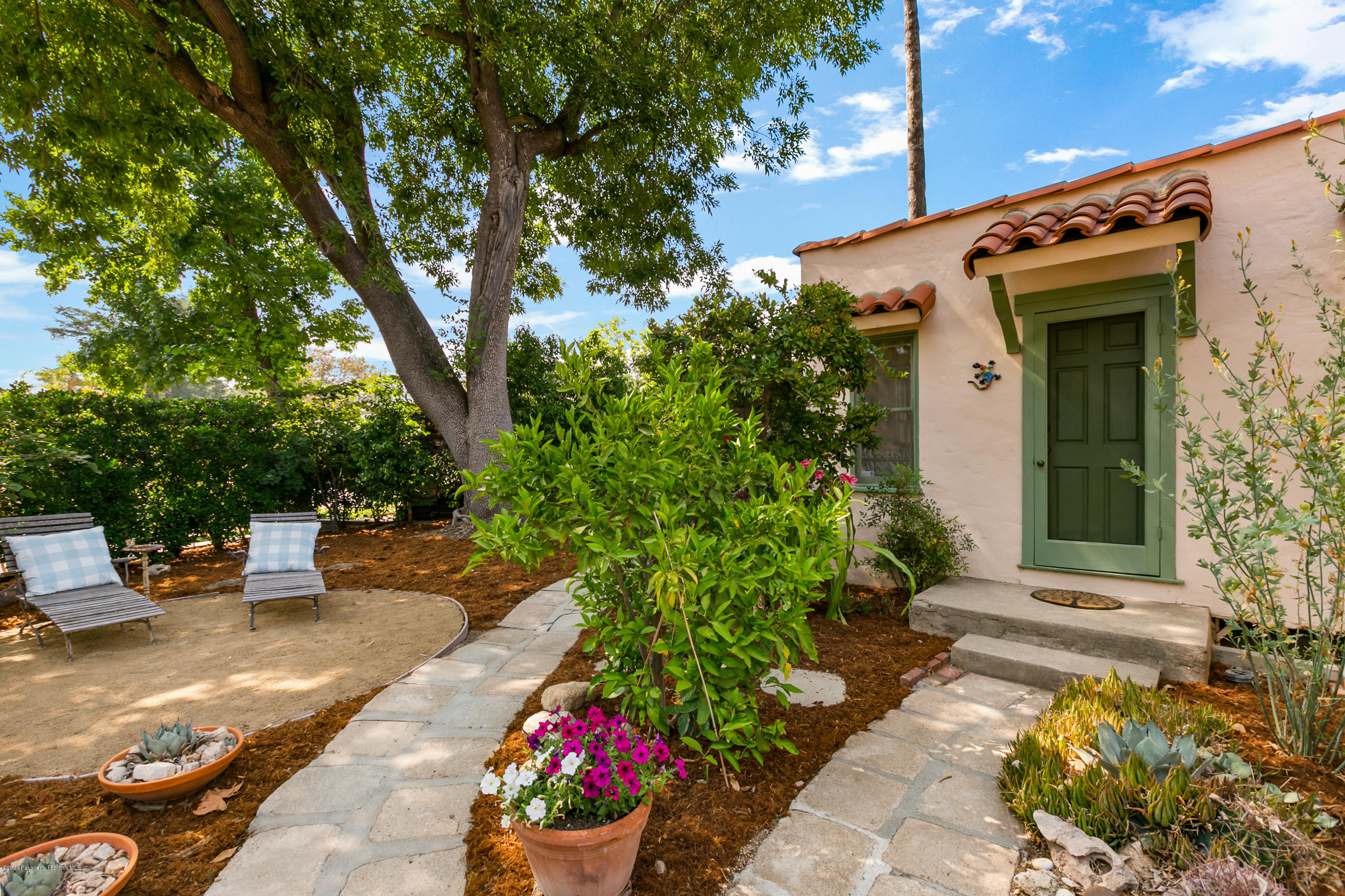1691 Meadowbrook Road Altadena, CA 91001 - Photo 23 of 35 a view of a patio with table and chairs and potted plants