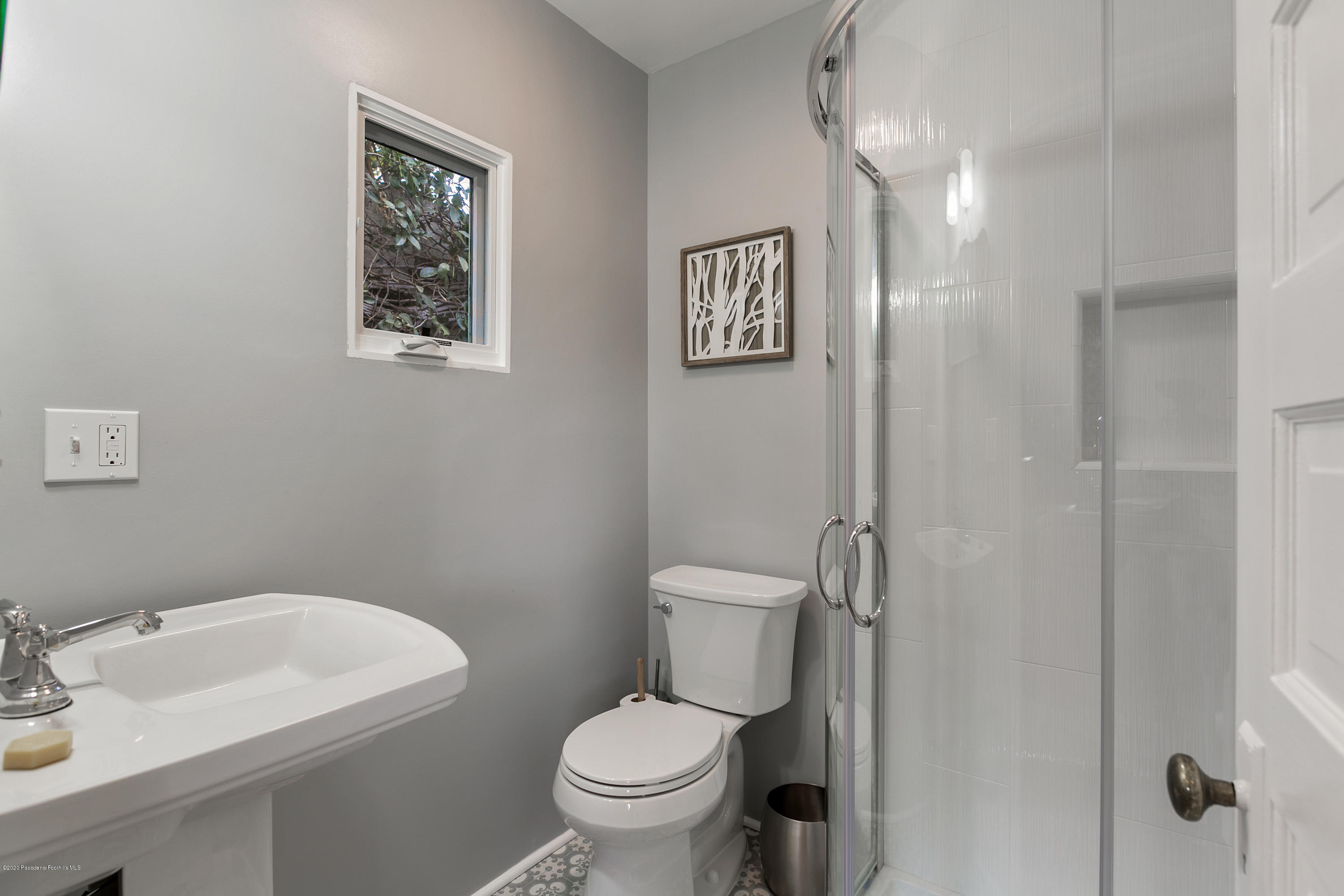 1691 Meadowbrook Road Altadena, CA 91001 - Photo 28 of 35 a white toilet sitting next to a bathroom sink