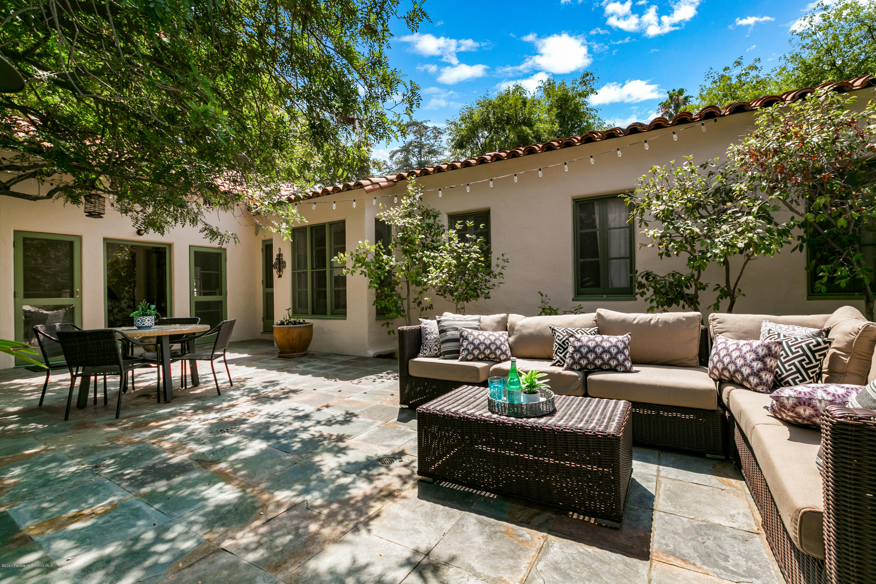 1691 Meadowbrook Road Altadena, CA 91001 - Photo 31 of 35 a view of a patio with couches table and chairs and potted plants