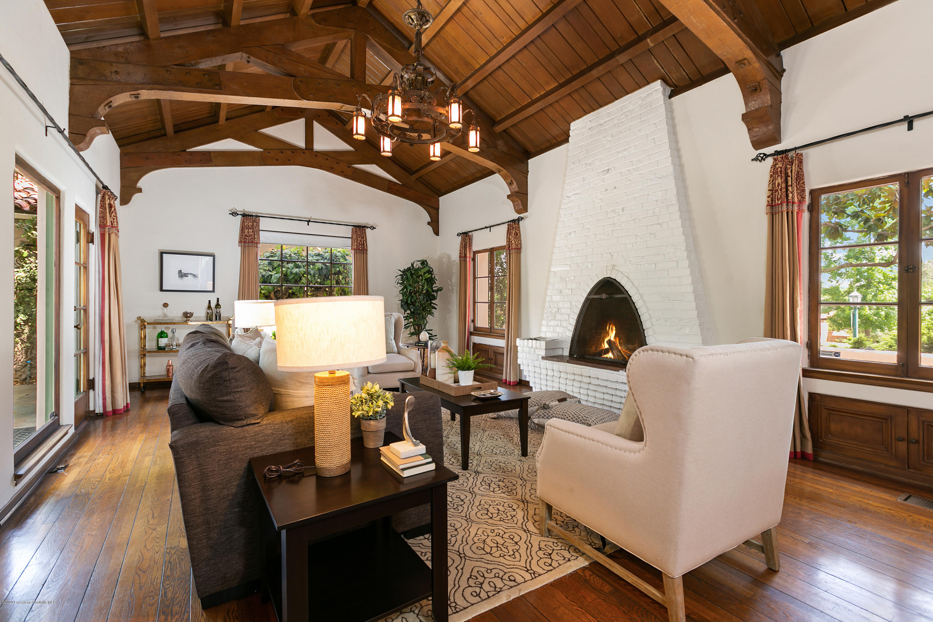1691 Meadowbrook Road Altadena, CA 91001 - Photo 6 of 35 a living room with furniture a chandelier and wooden floor