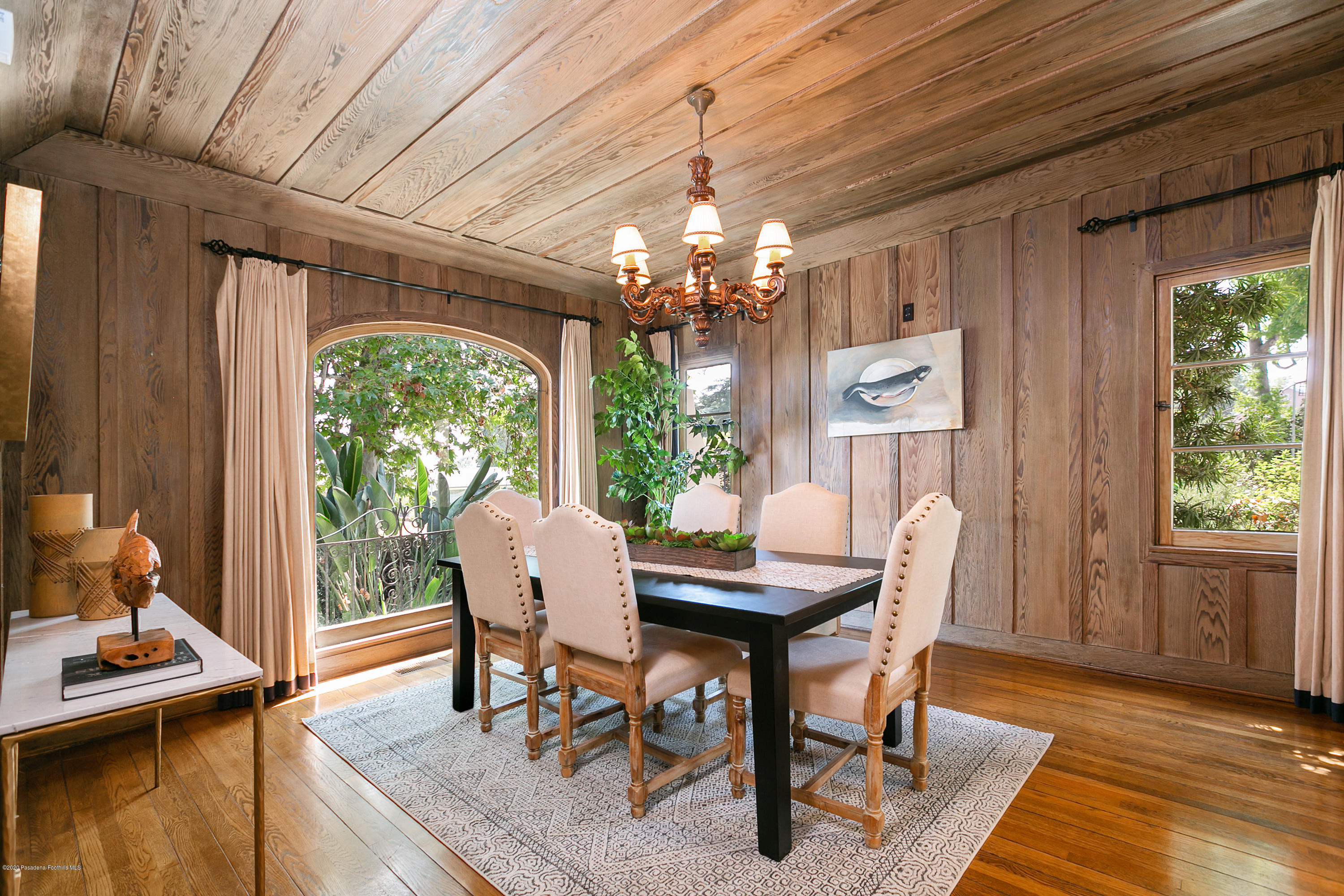 1691 Meadowbrook Road Altadena, CA 91001 - Photo 9 of 35 a dining room with furniture a chandelier and wooden floor