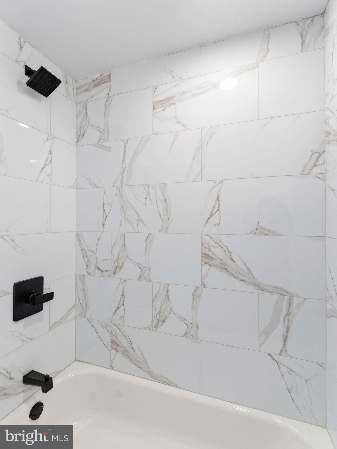 232 Washington Street Delanco, NJ 08075 - Photo 22 of 33 Elegant marble-inspired shower walls.