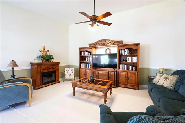 a view of a hallway with wooden floor and entryway