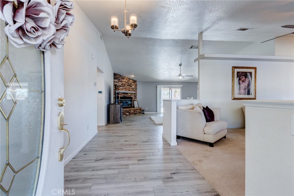 19783 Lara Lane Apple Valley, CA 92308 - Photo 11 of 42 a living room with furniture and a chandelier