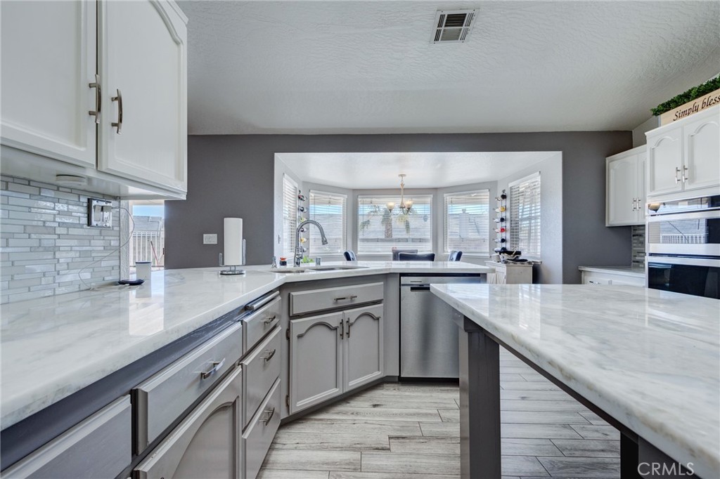19783 Lara Lane Apple Valley, CA 92308 - Photo 12 of 42 a kitchen with sink and cabinets