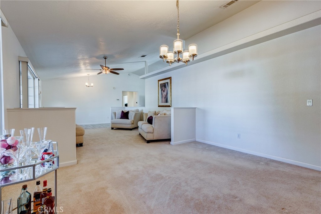 19783 Lara Lane Apple Valley, CA 92308 - Photo 20 of 42 a living room with furniture and a chandelier
