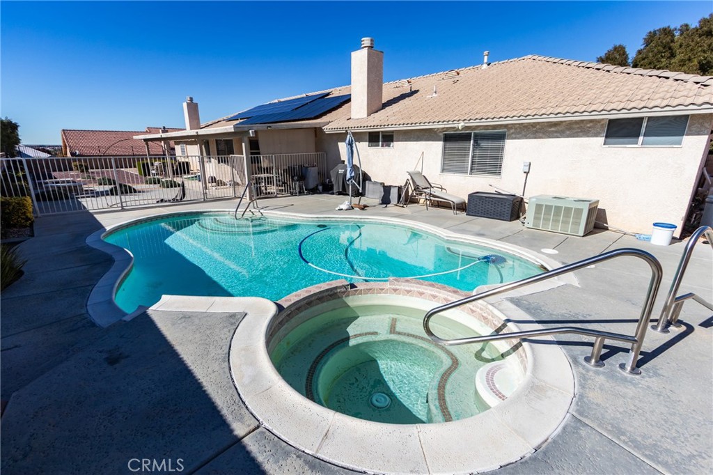 19783 Lara Lane Apple Valley, CA 92308 - Photo 37 of 42 a view of a swimming pool with a patio