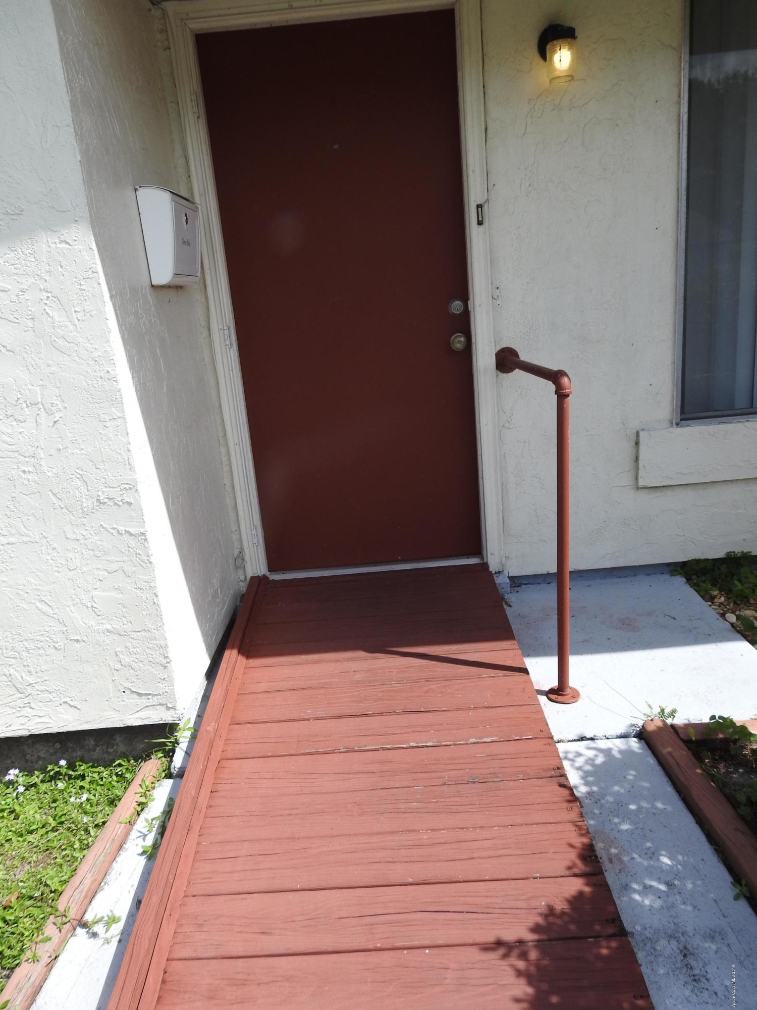 839 Chelsea Avenue Palm Bay, FL 32905 - Photo 2 of 17 Front walk
