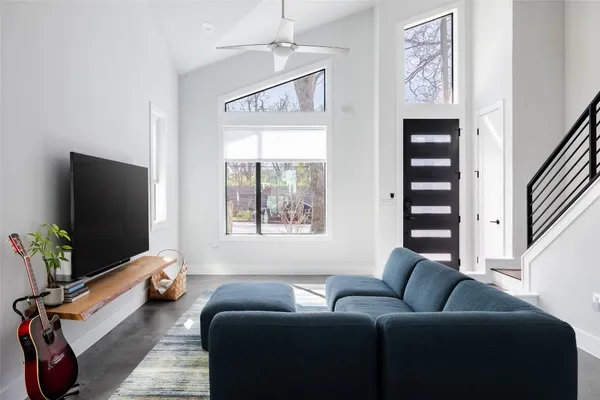 a living room with furniture and a flat screen tv