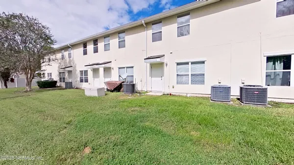 a view of yard with grass and a yard