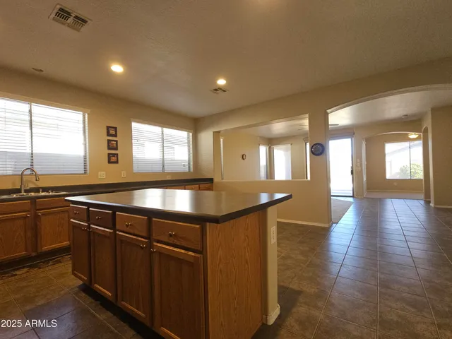 a kitchen with lots of counter top space and sink