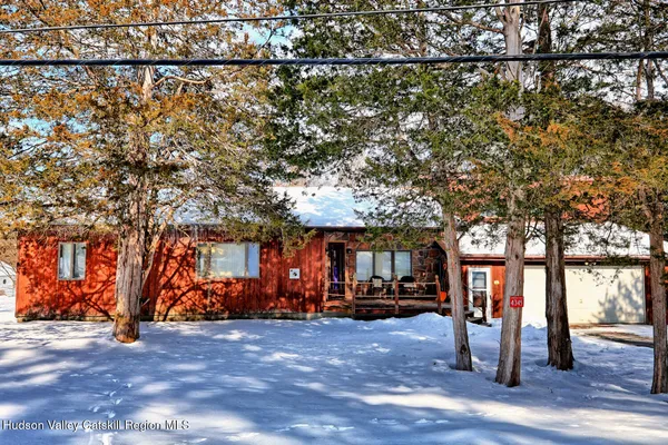 a view of street with large trees