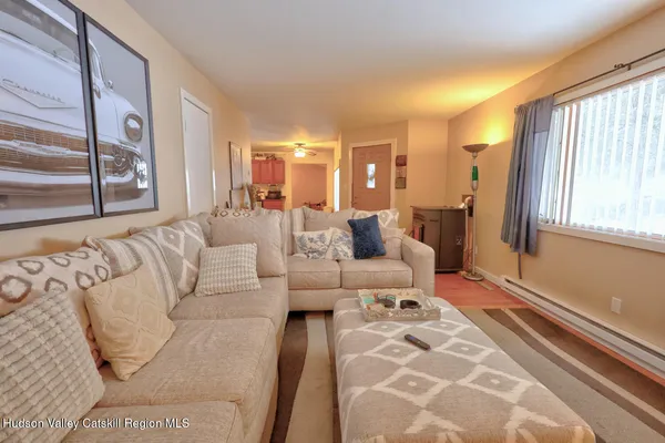 a living room with furniture and a window