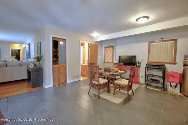 a living room with furniture and a rug