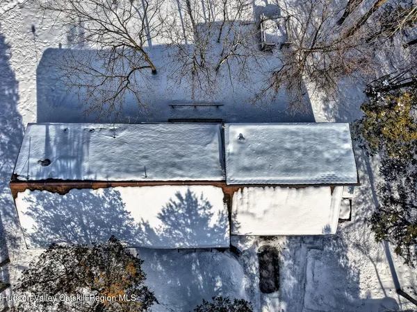 a view of a livingroom with furniture and a flat screen tv