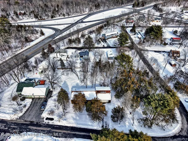 a kitchen with granite countertop wooden cabinets and a sink