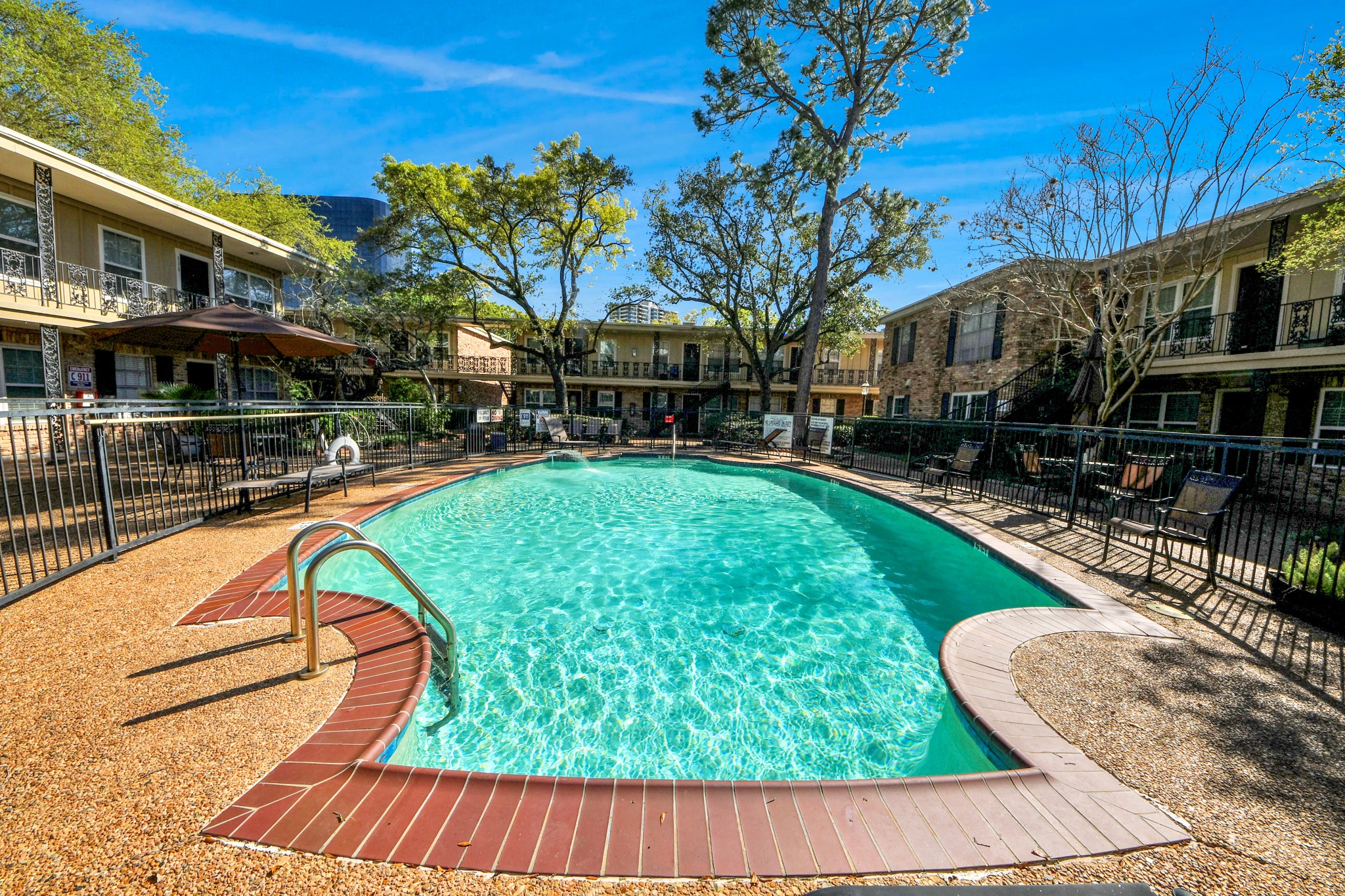 3224 Timmons Lane, Unit 168 Houston, TX 77027 - Photo 25 of 36 a view of swimming pool with outdoor seating and a patio
