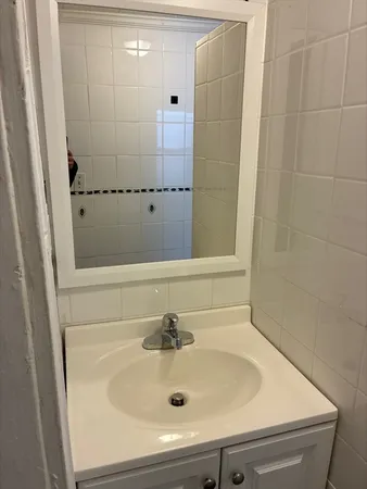 a bathroom with a sink and a shower
