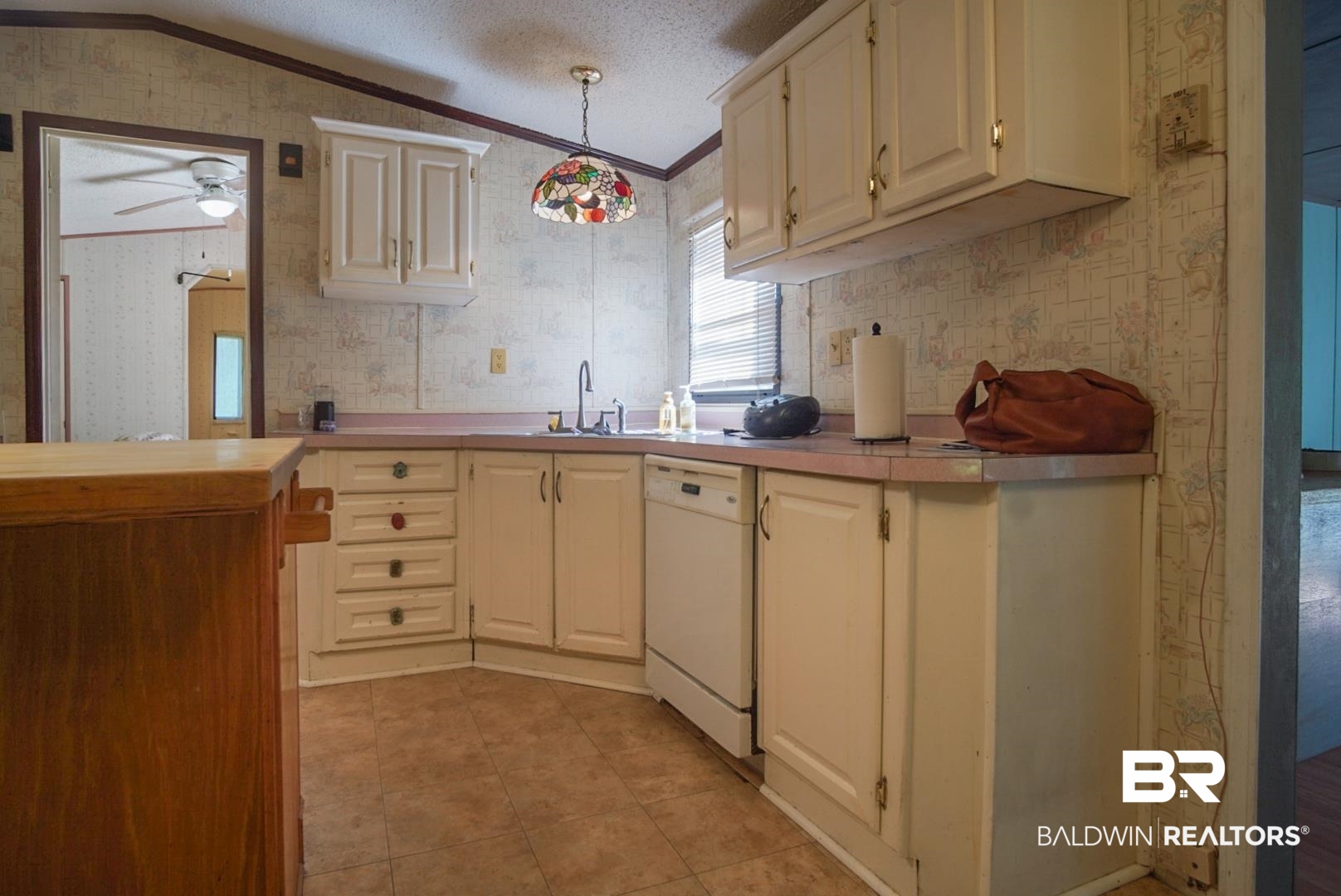 9190 County Road 97 Elberta, AL 36530 - Photo 16 of 53 Kitchen featuring ceiling fan, hanging light fixtures, sink, dishwasher, and light tile patterned floors