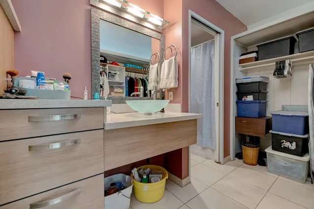 a kitchen with a refrigerator and stove