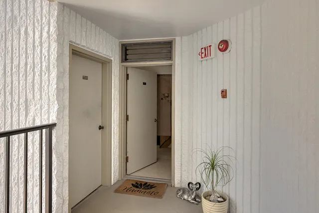 a view of an entryway with wooden floor