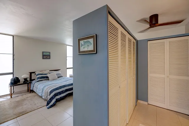 a bedroom with a bed and a cabinets