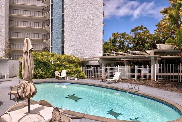 an aerial view of a house with swimming pool patio and outdoor seating