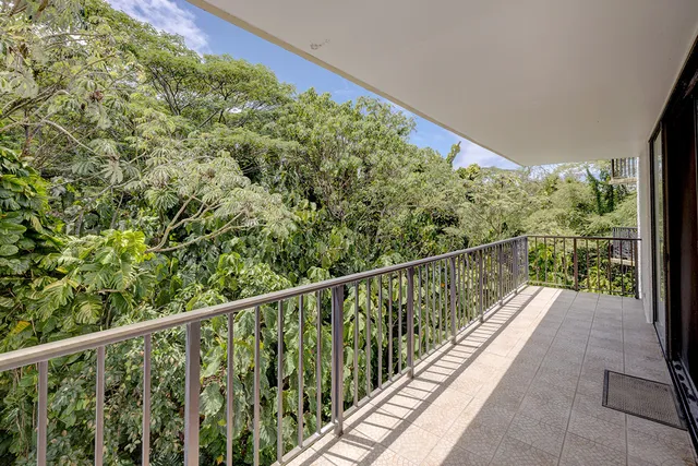 a view of balcony with wooden floor