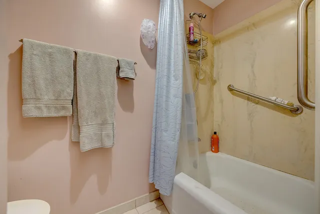 a bathroom with a shower and a tub