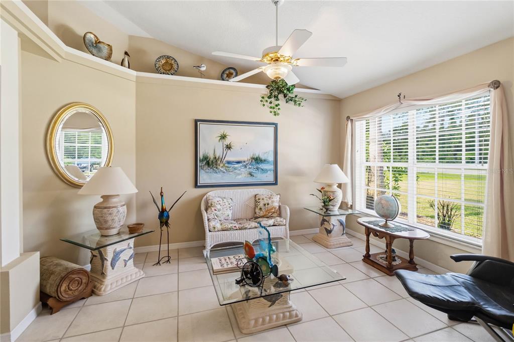 3225 Canoe Creek Road St. Cloud, FL 34772 - Photo 6 of 30 a living room with furniture a table and a large window