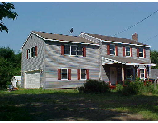55 Harlow Clark Road Huntington, MA 01050 - Photo 1 of 1 a front view of a house with a garden