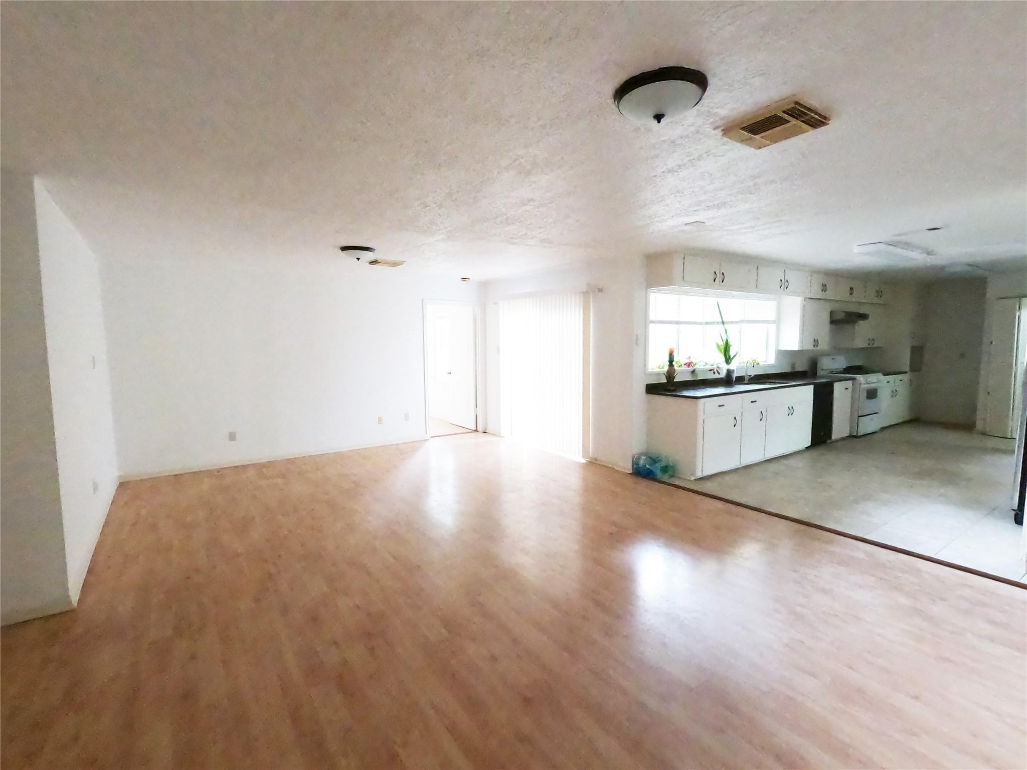 5231 Beechnut Street Houston, TX 77096 - Photo 12 of 19 a view of a kitchen with a sink and a stove top oven