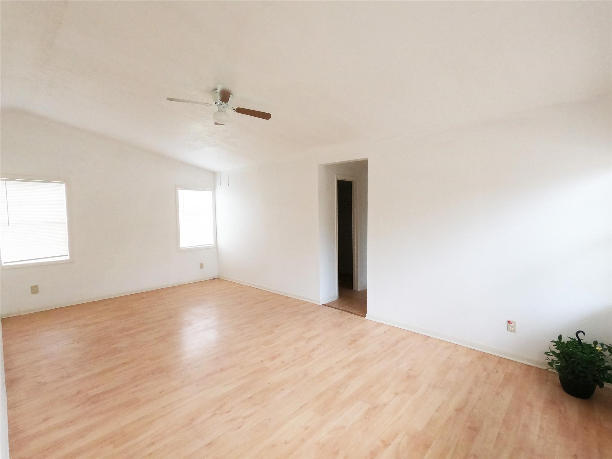 5231 Beechnut Street Houston, TX 77096 - Photo 16 of 19 a view of an empty room with a window
