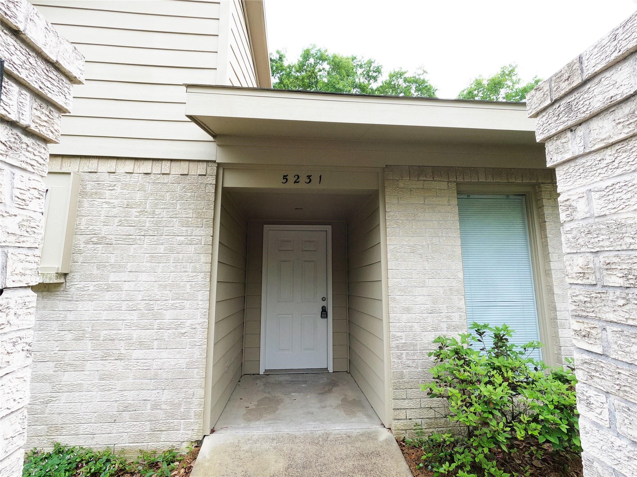 5231 Beechnut Street Houston, TX 77096 - Photo 2 of 19 a front view of a house with plants