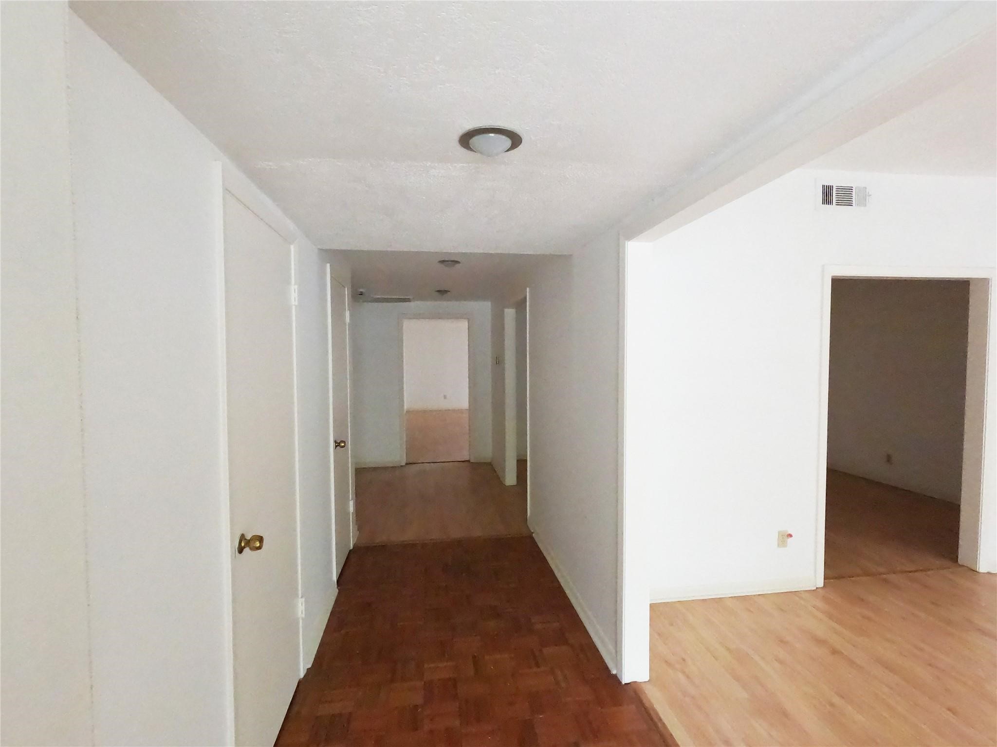 5231 Beechnut Street Houston, TX 77096 - Photo 3 of 19 a view of a hallway