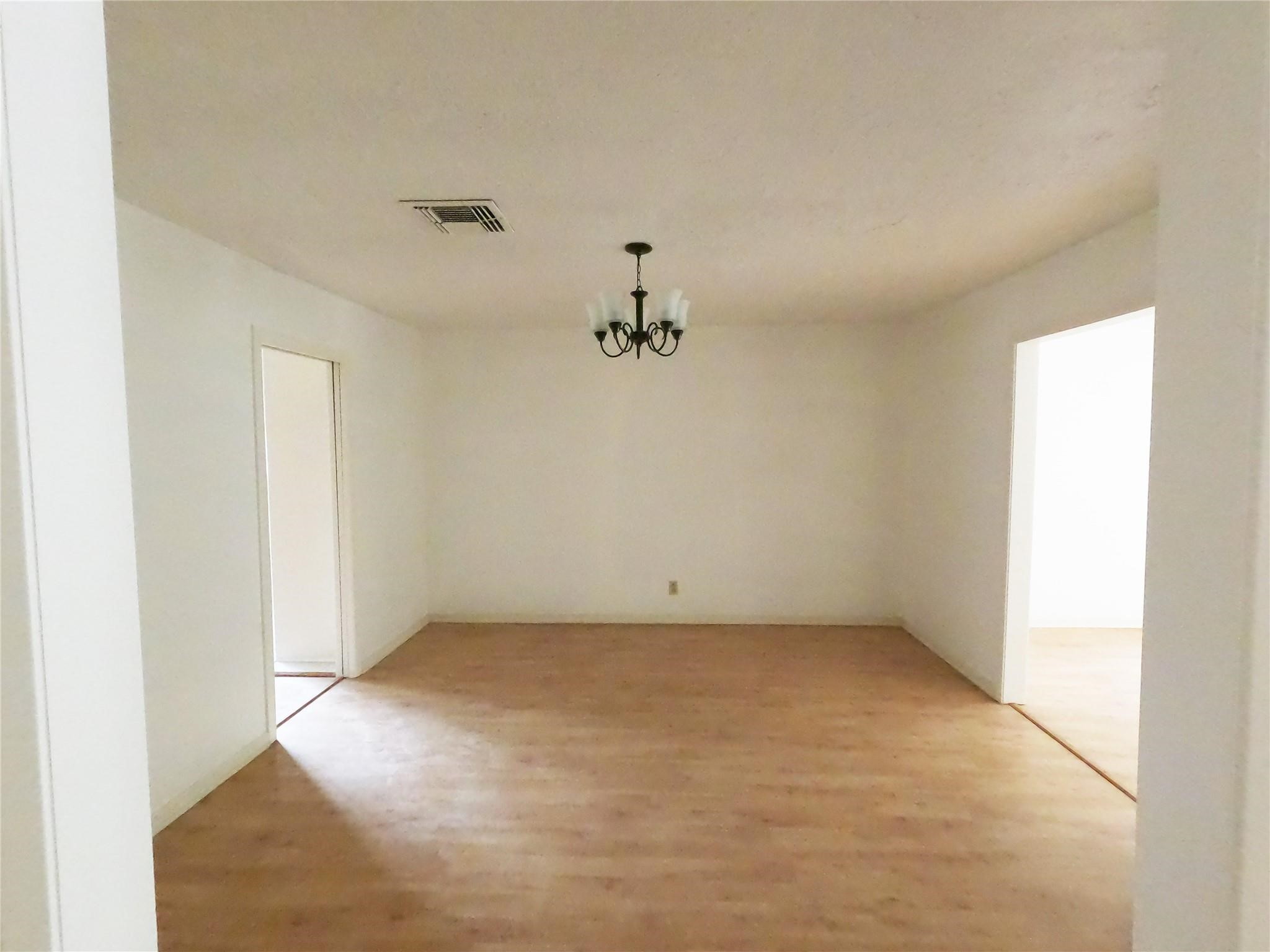 5231 Beechnut Street Houston, TX 77096 - Photo 5 of 19 an empty room with a window