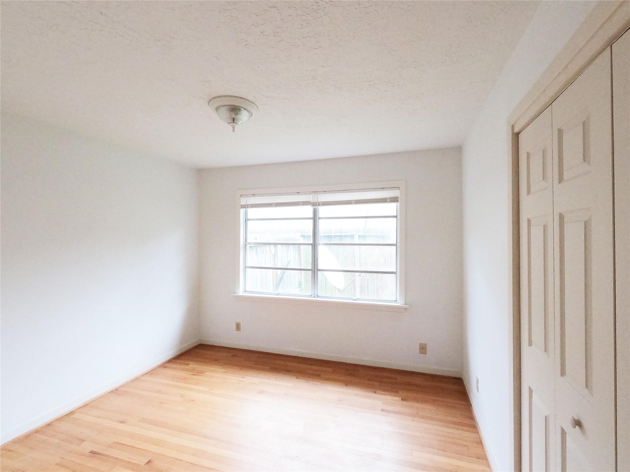 5231 Beechnut Street Houston, TX 77096 - Photo 9 of 19 an empty room with a window