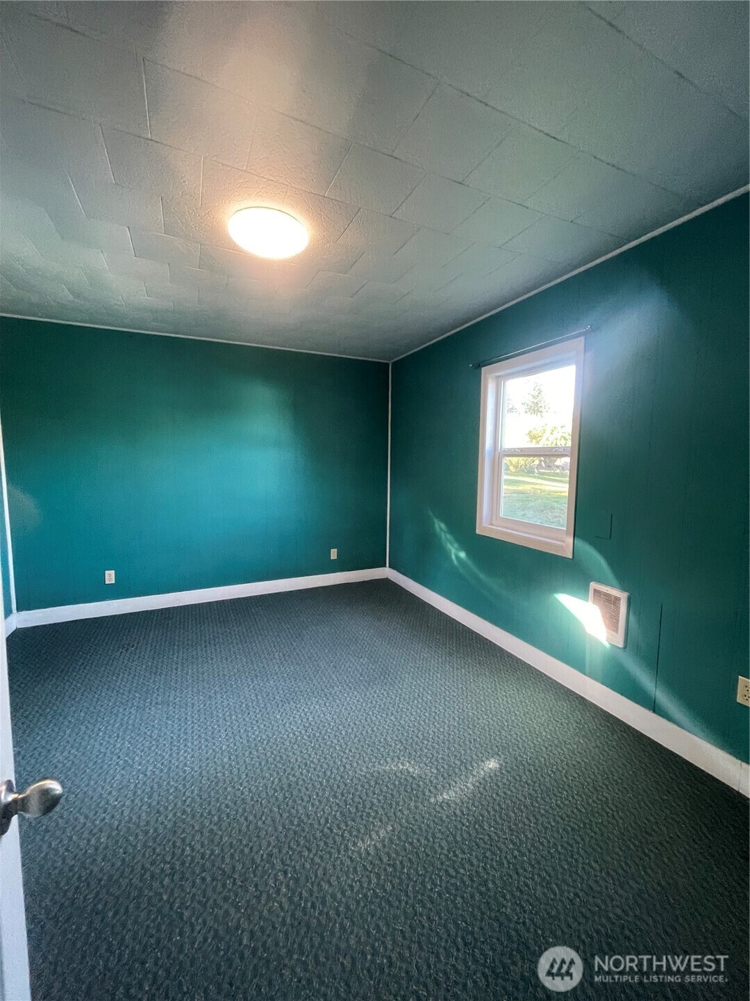 1052 Ballentine Street Raymond, WA 98577 - Photo 12 of 14 a view of an empty room with a window