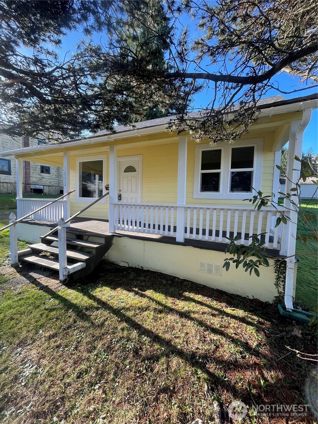 1052 Ballentine Street Raymond, WA 98577 - Photo 2 of 14 a view of a house with a wooden deck