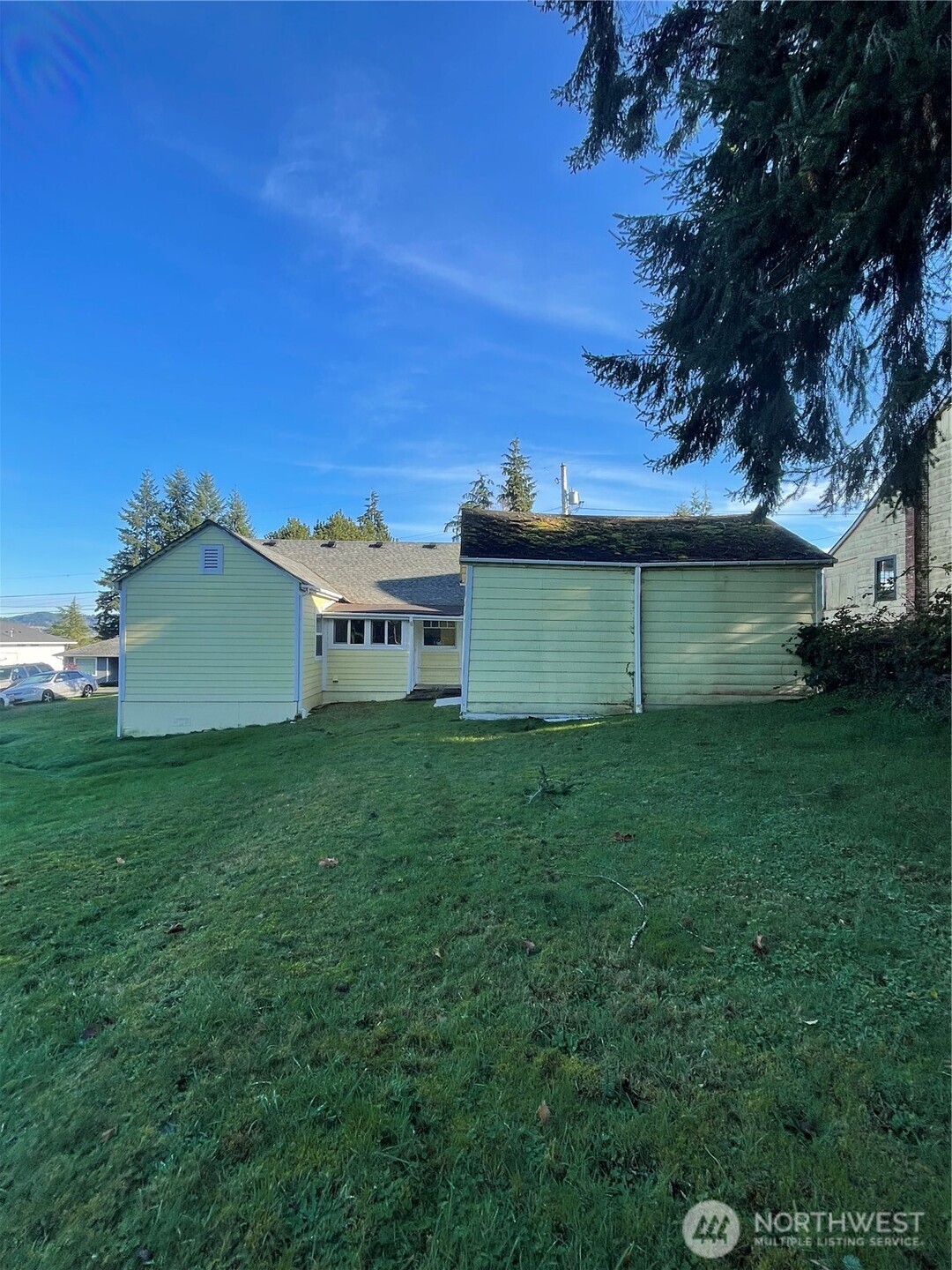 1052 Ballentine Street Raymond, WA 98577 - Photo 3 of 14 a view of a backyard with a garden