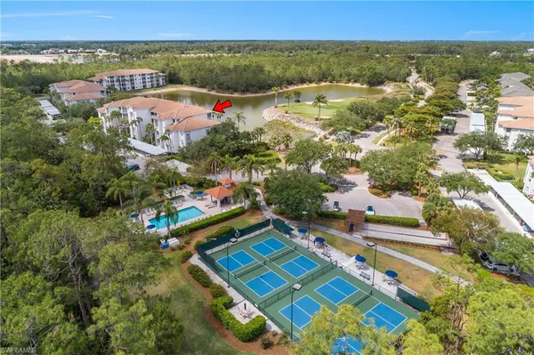 an aerial view of residential house with outdoor space and swimming pool