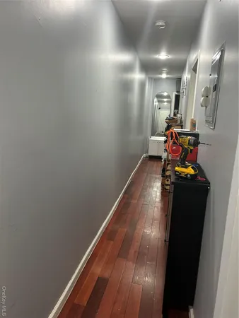 a bedroom with bed and a chandelier